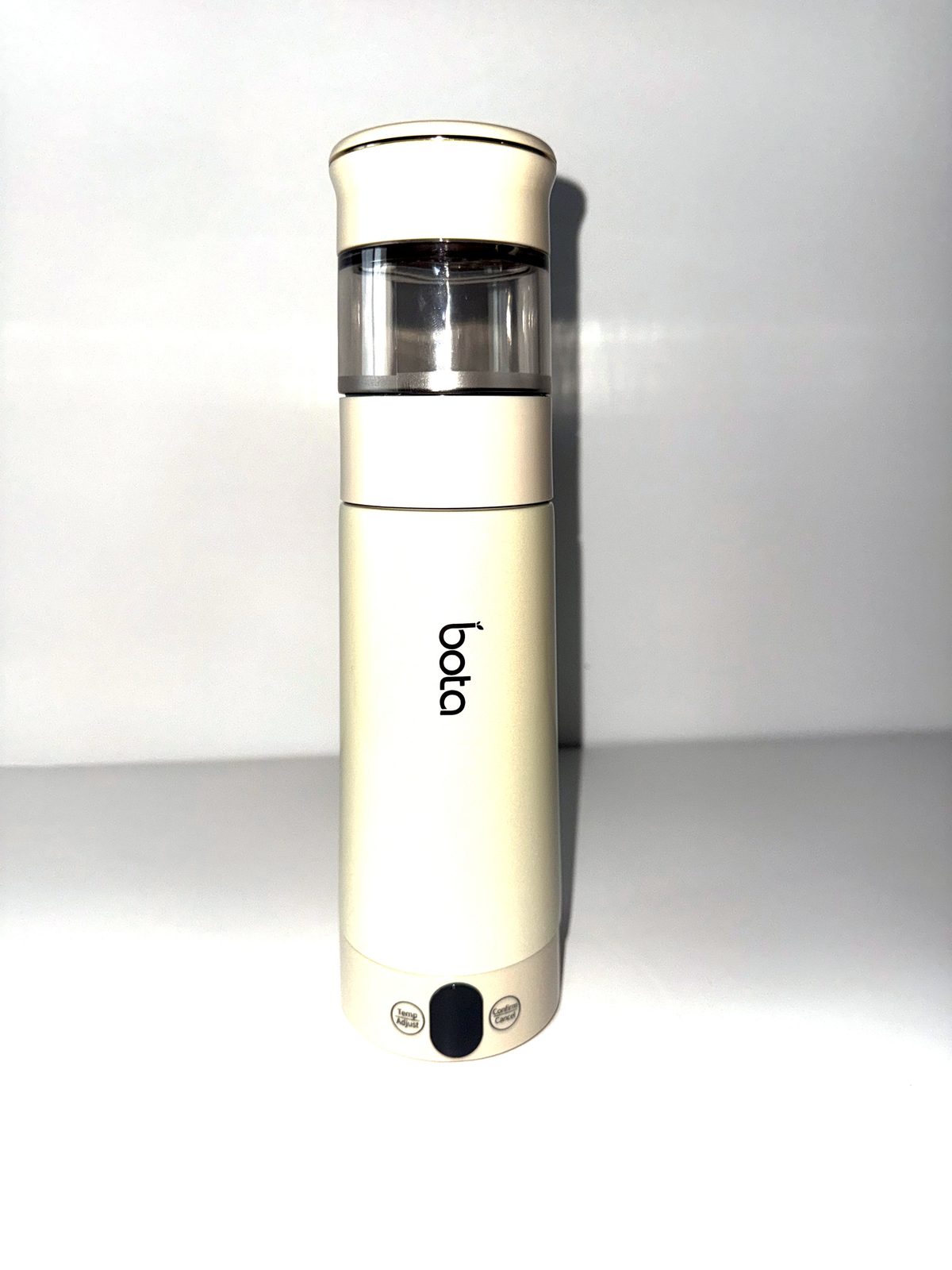 Electric tea bottle in apricot with the steeping chamber attached