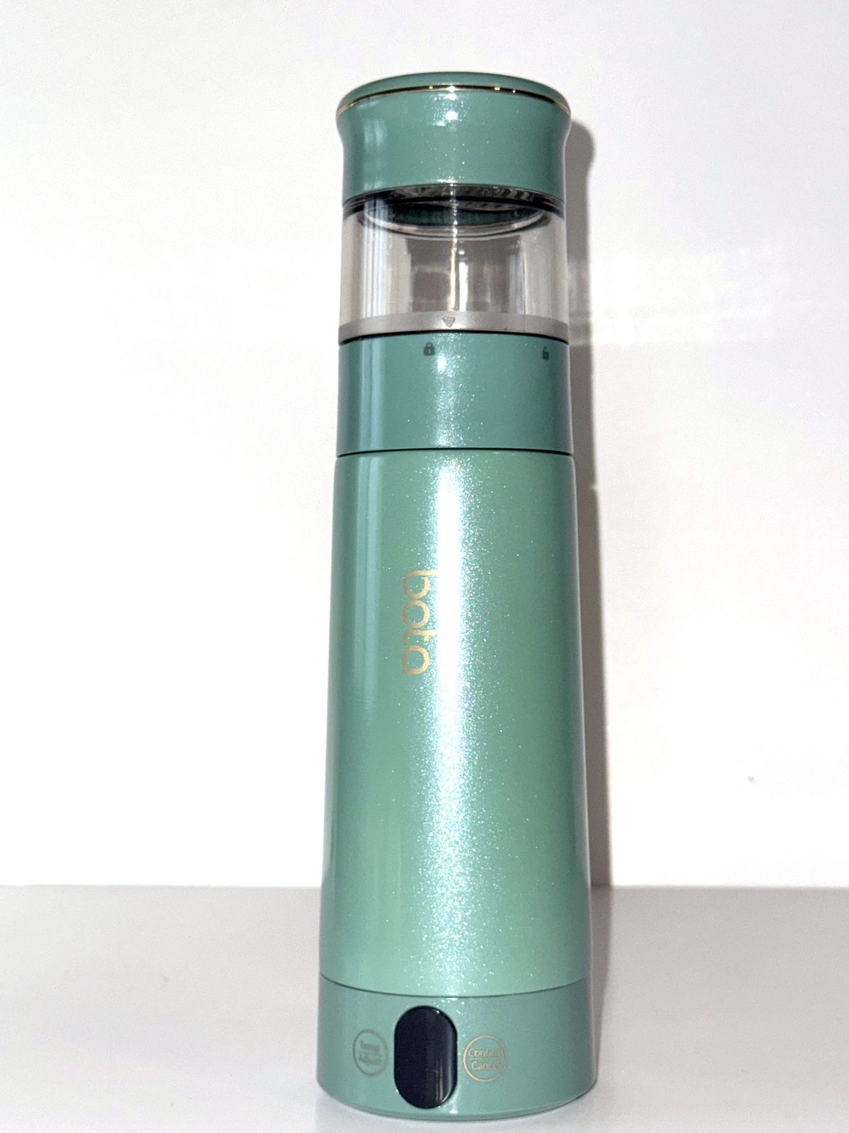 Electric tea bottle in mint green with the steeping chamber attached